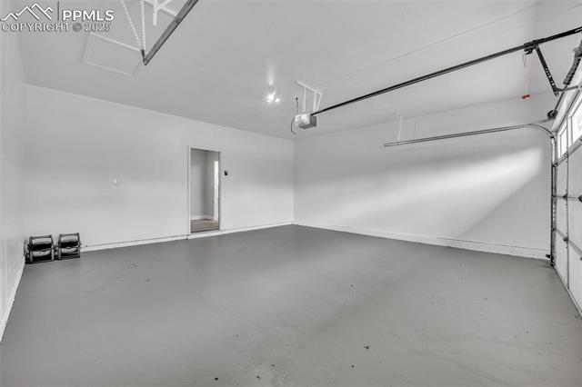 2004 Monterey Road Colorado Springs, CO 80910 - Photo 18 of 27 Garage featuring a garage door opener