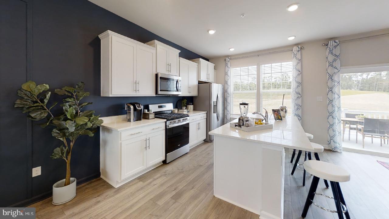 2113 Ruby Turn Bowie, MD 20721 - Photo 11 of 48 a kitchen with appliances a sink and cabinets