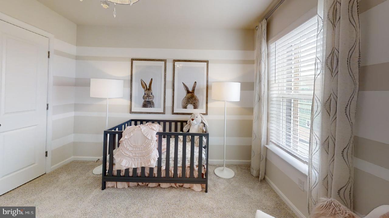 2113 Ruby Turn Bowie, MD 20721 - Photo 14 of 48 a bed sitting in a room next to a window