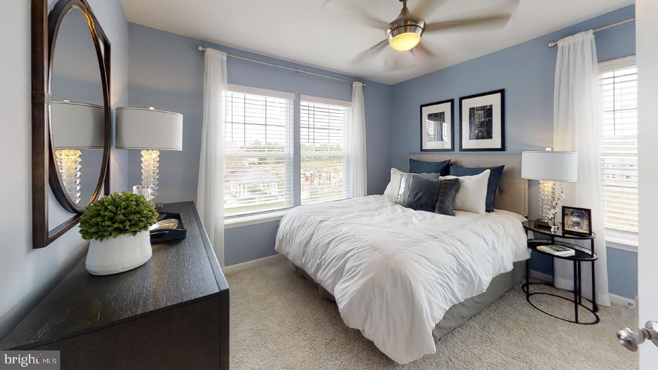 2113 Ruby Turn Bowie, MD 20721 - Photo 16 of 48 a bedroom with a large bed and a potted plant