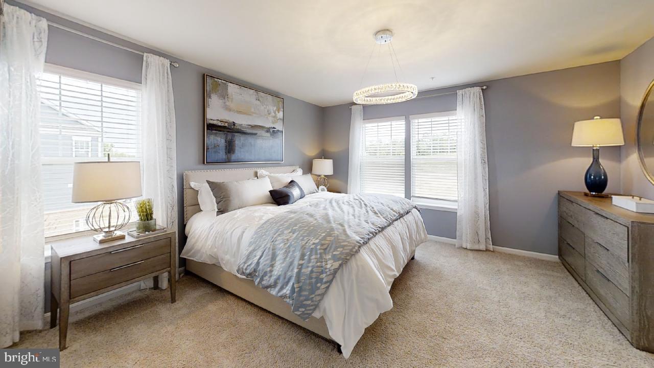 2113 Ruby Turn Bowie, MD 20721 - Photo 17 of 48 a bed room with a bed and a lamp