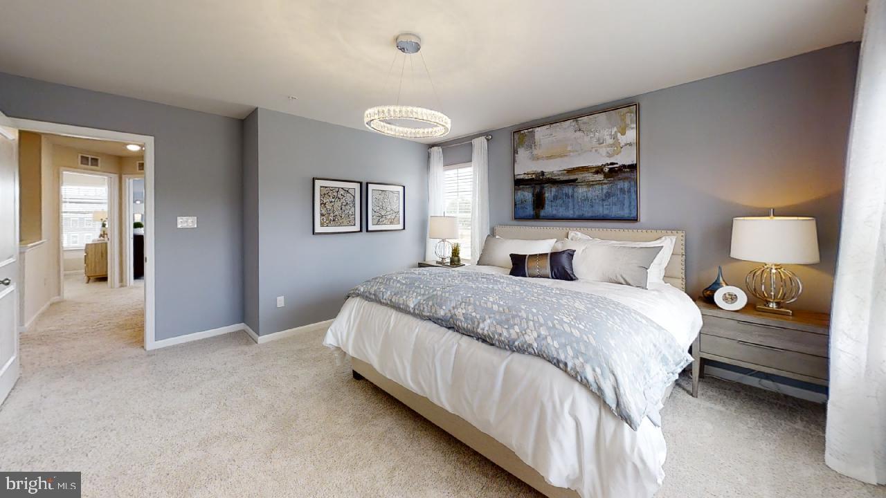 2113 Ruby Turn Bowie, MD 20721 - Photo 18 of 48 a bedroom with a bed and a lamp