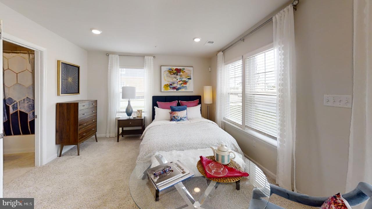 2113 Ruby Turn Bowie, MD 20721 - Photo 19 of 48 a bedroom with a bed and wooden floor