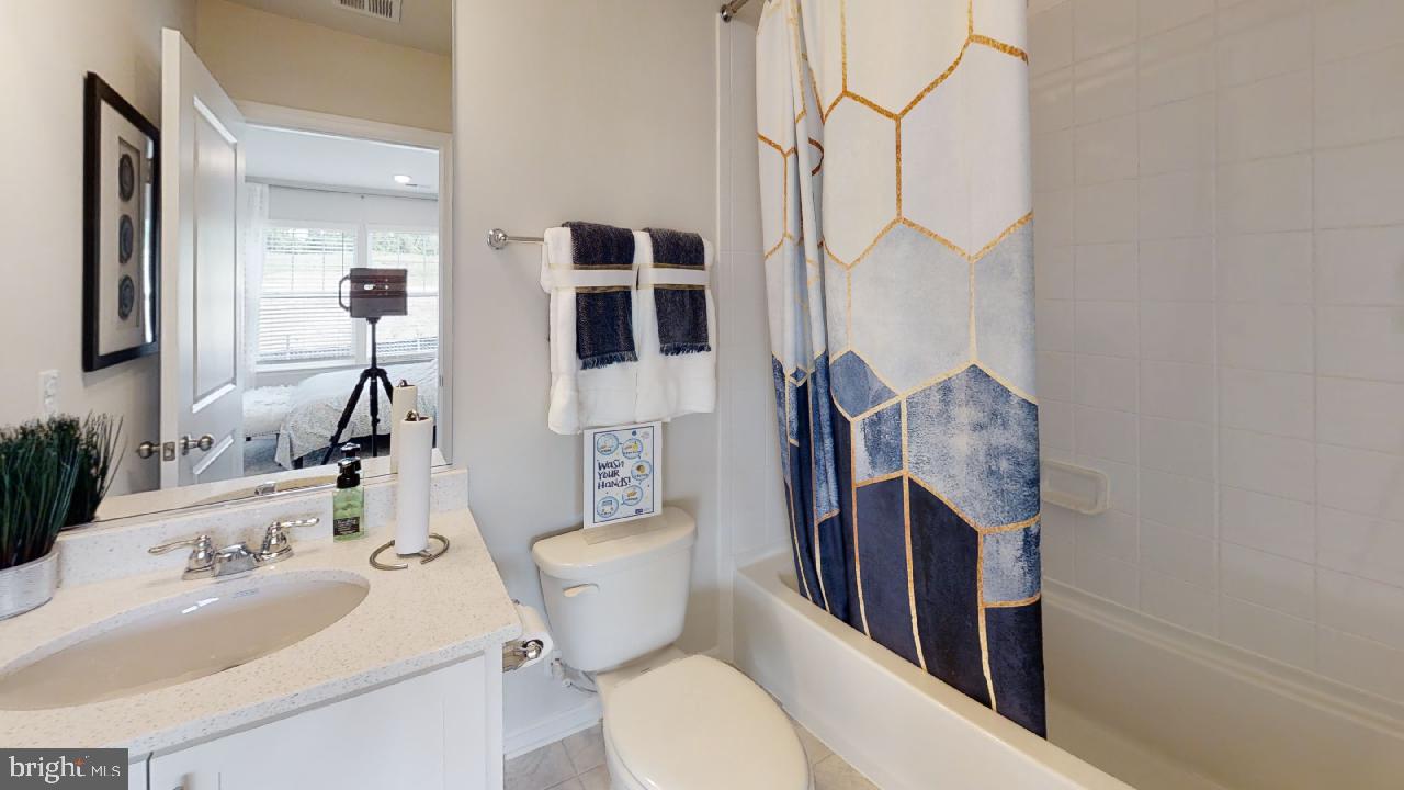 2113 Ruby Turn Bowie, MD 20721 - Photo 23 of 48 a bathroom with a toilet sink and mirror