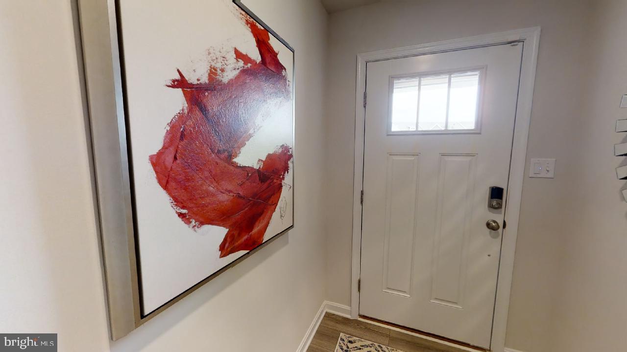 2113 Ruby Turn Bowie, MD 20721 - Photo 25 of 48 a view of a hallway that has a painting on the wall