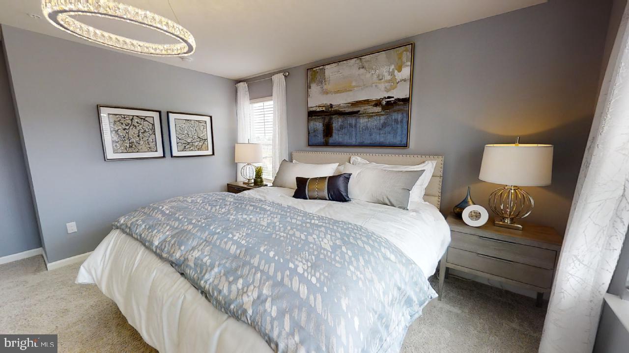 2113 Ruby Turn Bowie, MD 20721 - Photo 35 of 48 a bedroom with a bed and a painting on the wall