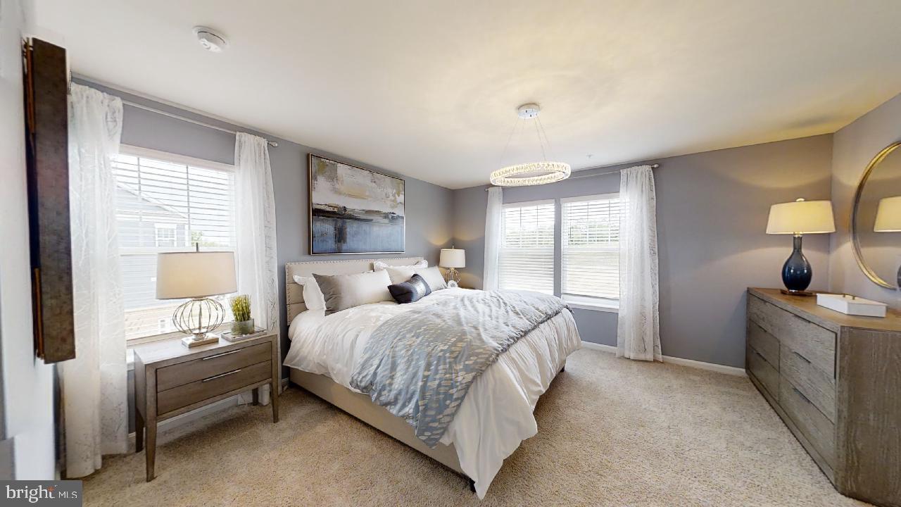 2113 Ruby Turn Bowie, MD 20721 - Photo 36 of 48 a bedroom with a large bed and a window