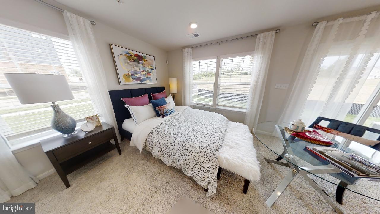 2113 Ruby Turn Bowie, MD 20721 - Photo 39 of 48 a bedroom with a bed and wooden floor