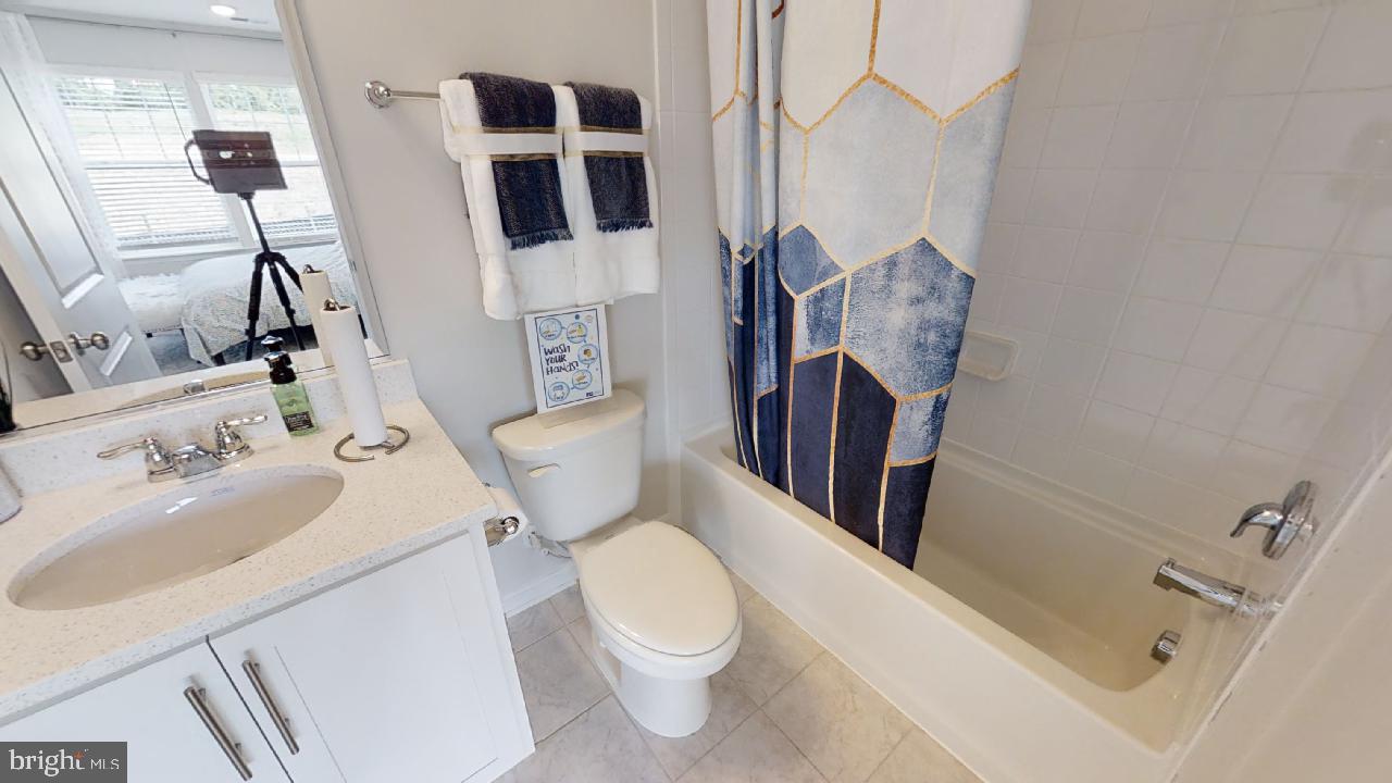 2113 Ruby Turn Bowie, MD 20721 - Photo 40 of 48 a white toilet sitting next to a bathroom sink