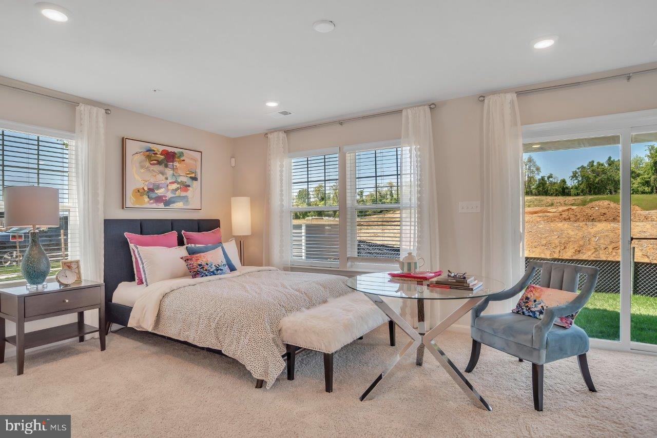 2113 Ruby Turn Bowie, MD 20721 - Photo 7 of 48 a bedroom with a bed and large window