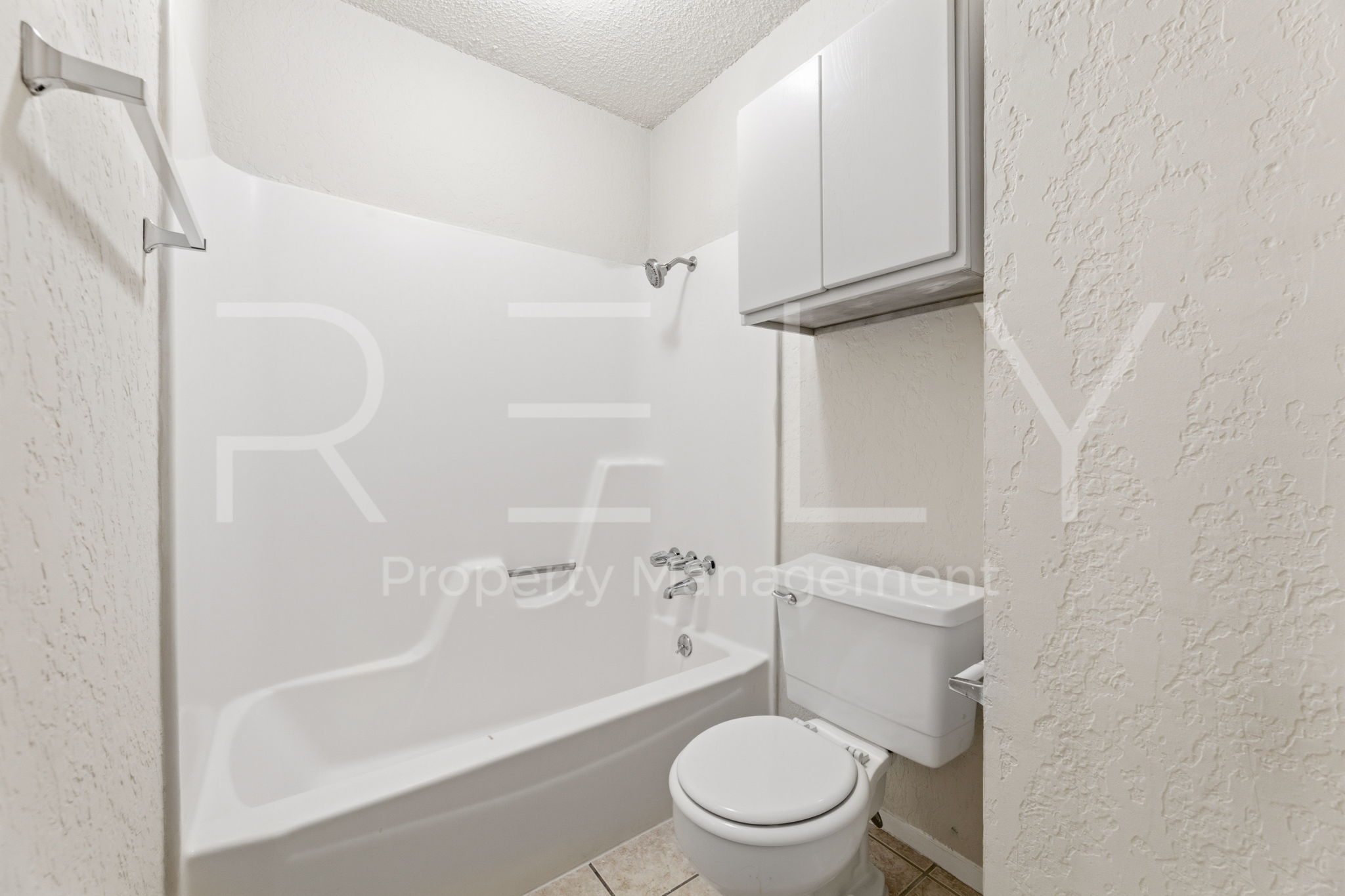 1005 Milford Way, Unit A Austin, TX 78745 - Photo 25 of 30 a bathroom with a toilet and a shower
