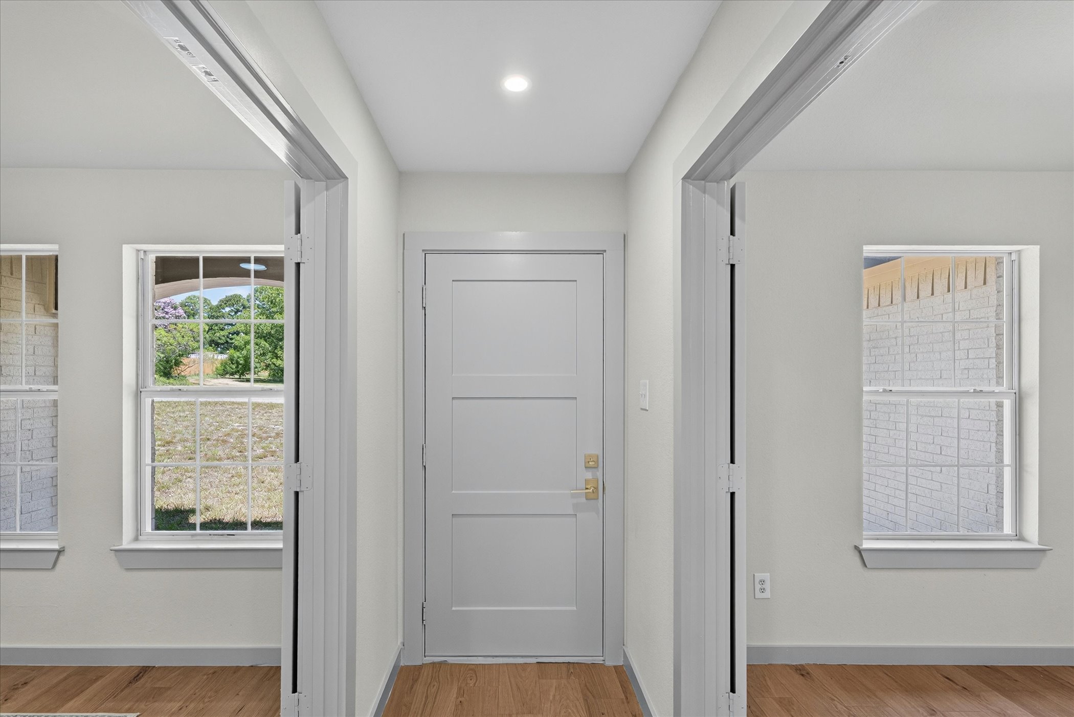 258 Pine View Loop Bastrop, TX 78602 - Photo 7 of 40 A welcoming entryway with recessed lighting and hardwood flooring sets a clean, inviting tone.
