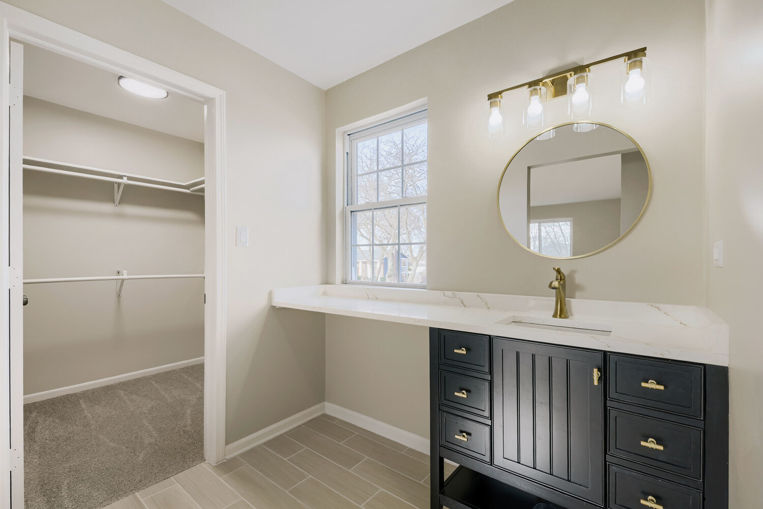 141 Timberlane Road Matteson, IL 60443 - Photo 17 of 27 a bathroom with a sink a light fixture and a mirror