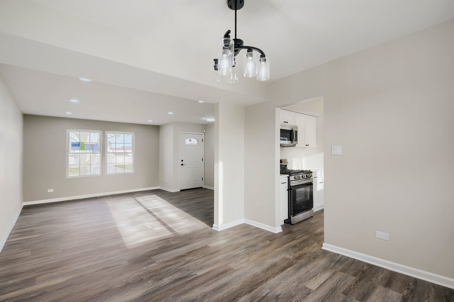 141 Timberlane Road Matteson, IL 60443 - Photo 6 of 27 a view of an empty room with window and wooden floor