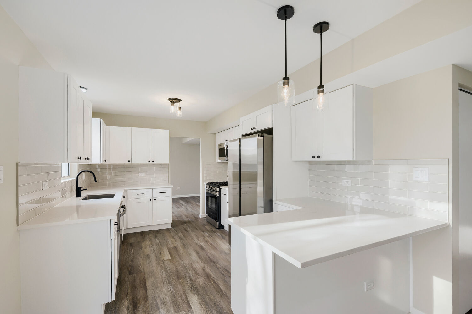 141 Timberlane Road Matteson, IL 60443 - Photo 7 of 27 a kitchen with a sink a stove a refrigerator and cabinets