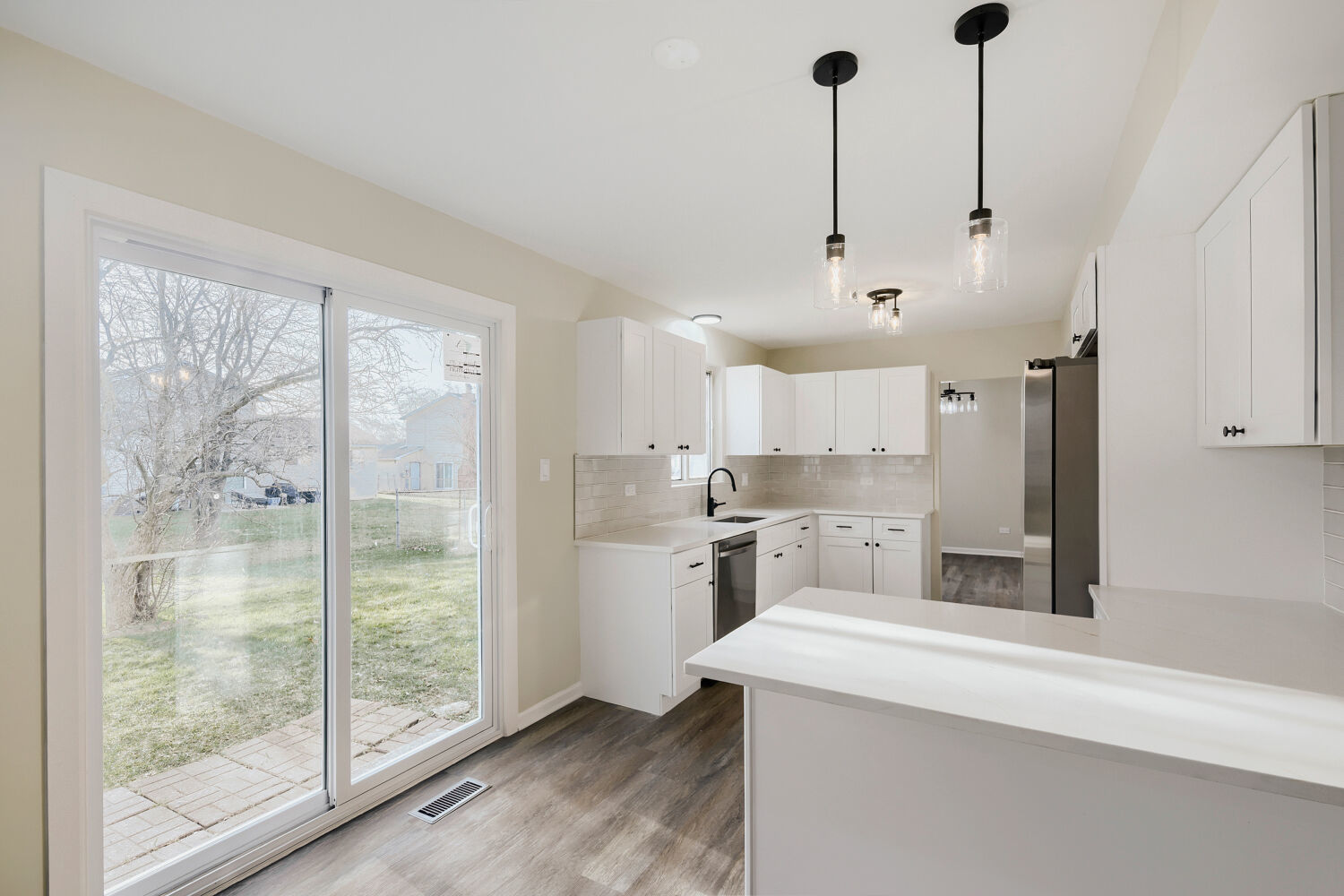 141 Timberlane Road Matteson, IL 60443 - Photo 9 of 27 a kitchen with kitchen island a sink stove and refrigerator