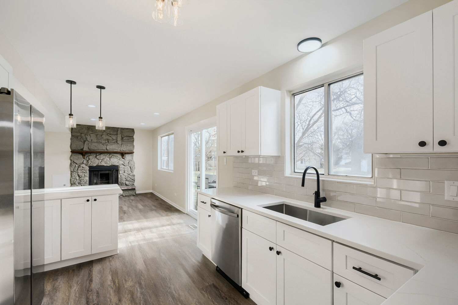 141 Timberlane Road Matteson, IL 60443 - Photo 10 of 27 a kitchen with stainless steel appliances a sink a stove a refrigerator wooden floor and cabinets