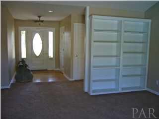5025 Roland Road Pace, FL 32571 - Photo 3 of 11 Entry way, and bookshelves to LR