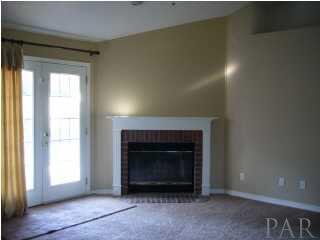 5025 Roland Road Pace, FL 32571 - Photo 4 of 11 Living room: french doors open to patio and pool.