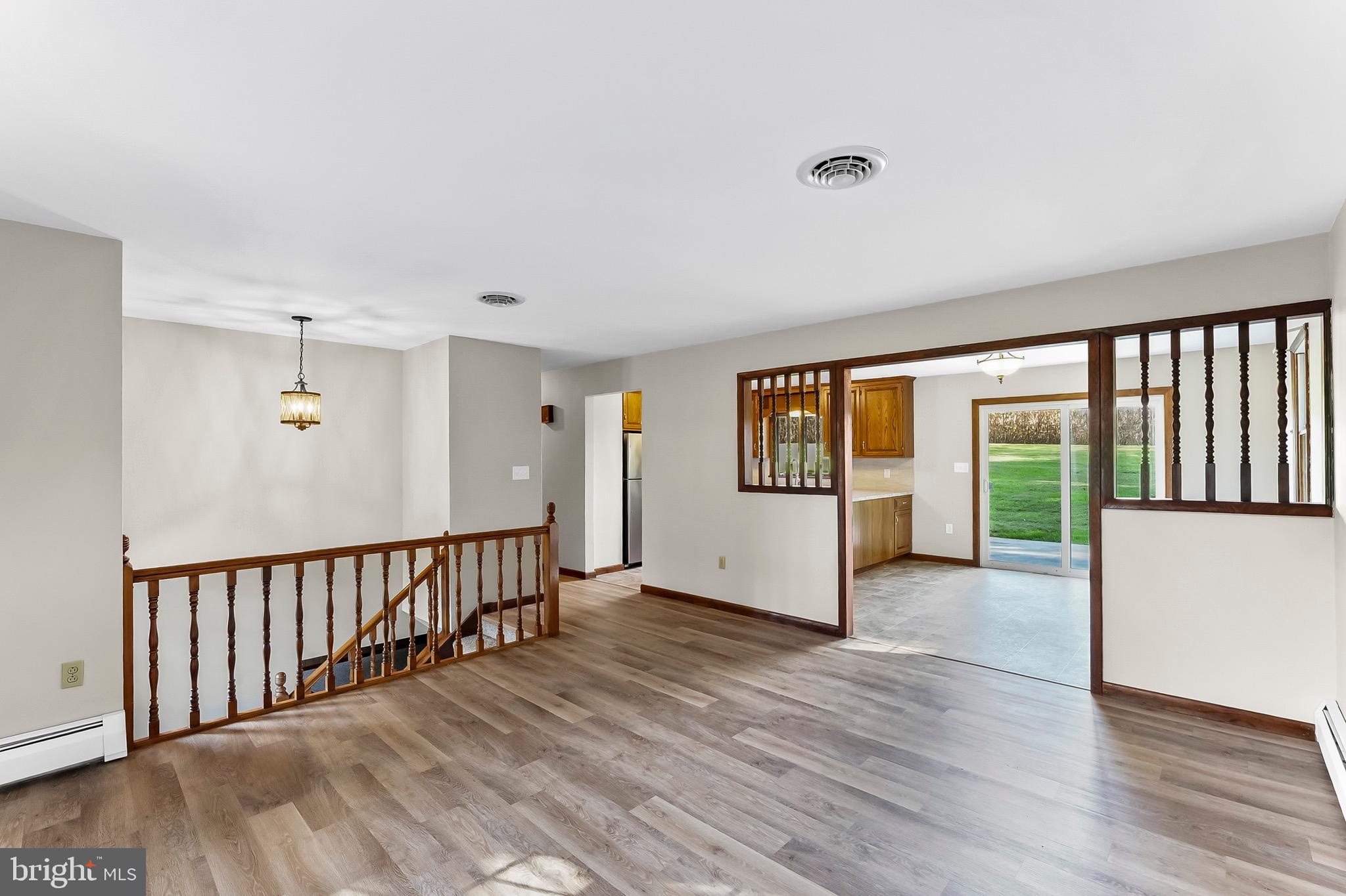 350 Roneys Corner Road Oxford, PA 19363 - Photo 7 of 18 a view of an empty room with wooden floor and a window