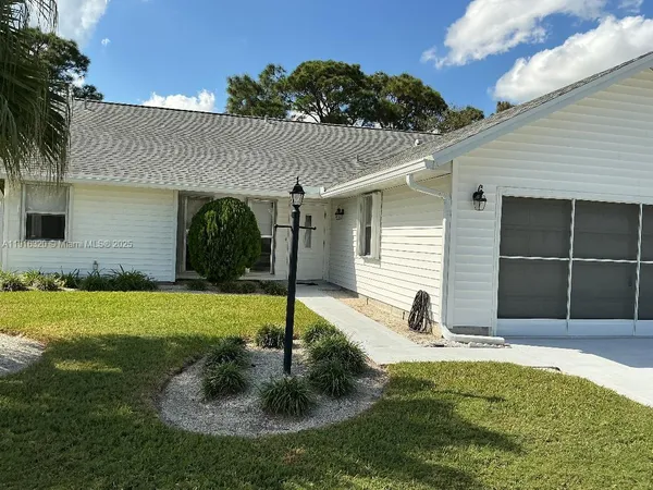 a house with garden in front of it