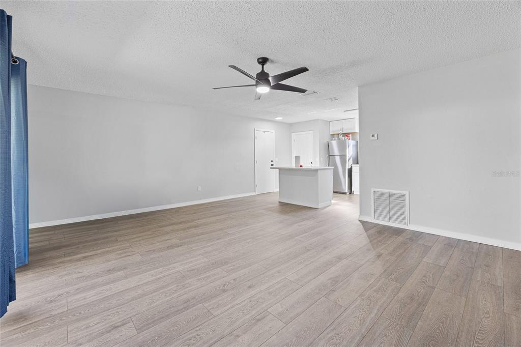 2 Oak Court Pass Ocala, FL 34472 - Photo 11 of 28 a view of a kitchen with wooden floor and a ceiling fan
