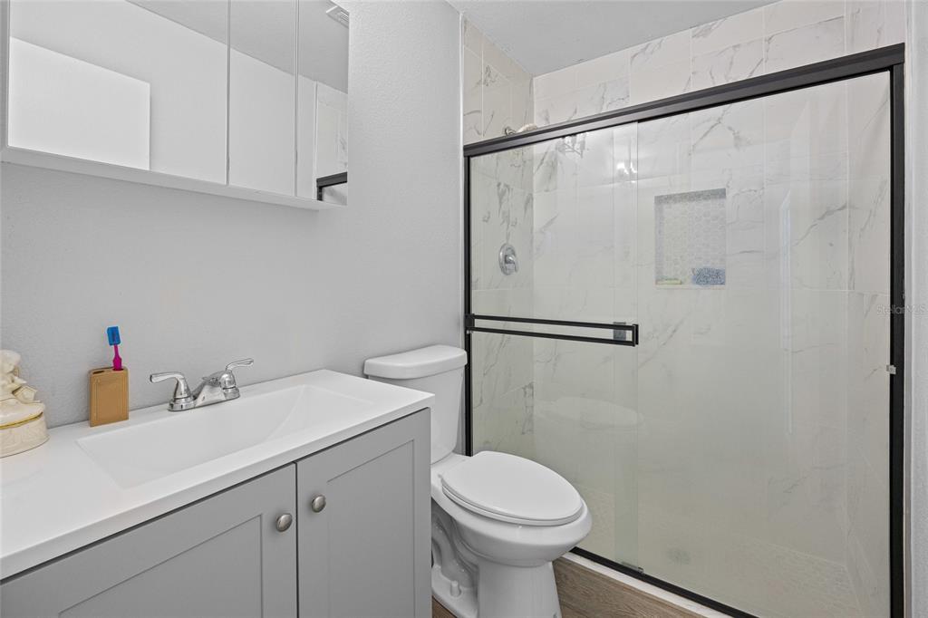 2 Oak Court Pass Ocala, FL 34472 - Photo 14 of 28 a bathroom with a sink a toilet and shower