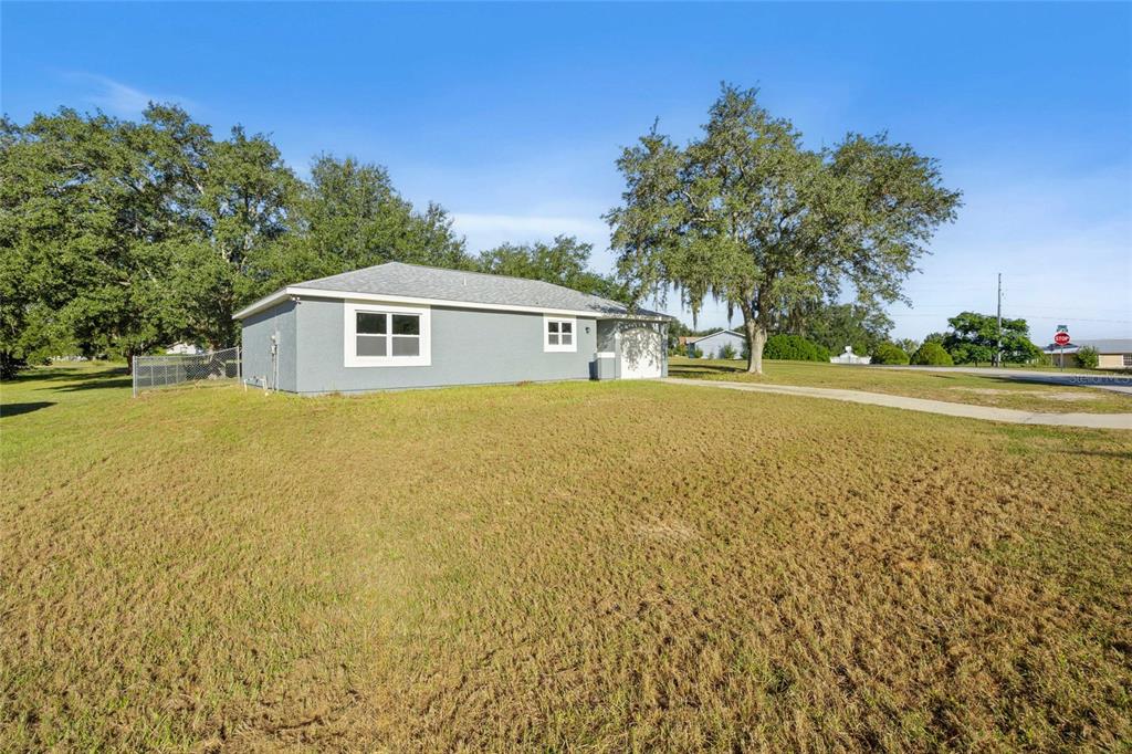 2 Oak Court Pass Ocala, FL 34472 - Photo 2 of 28 a front view of a house with a yard