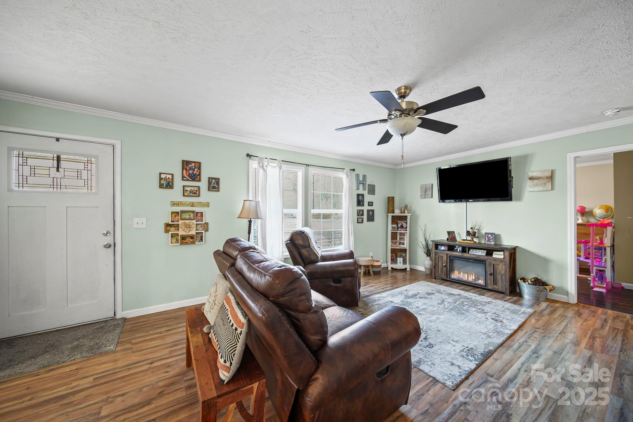 30291 C Red Hill Road Albemarle, NC 28001 - Photo 14 of 45 a living room with furniture and a flat screen tv