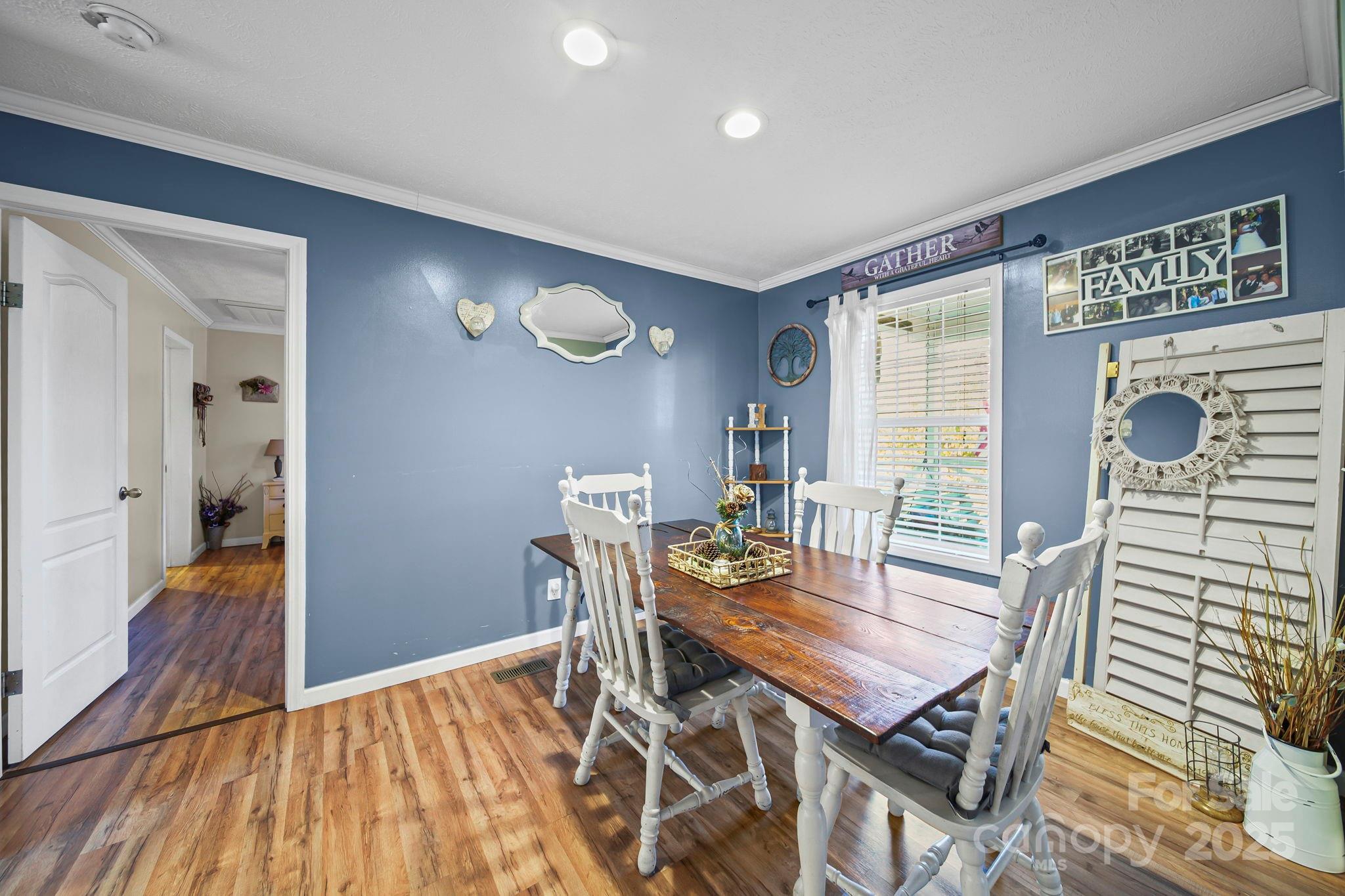 30291 C Red Hill Road Albemarle, NC 28001 - Photo 15 of 45 a view of a dining room with furniture and wooden floor