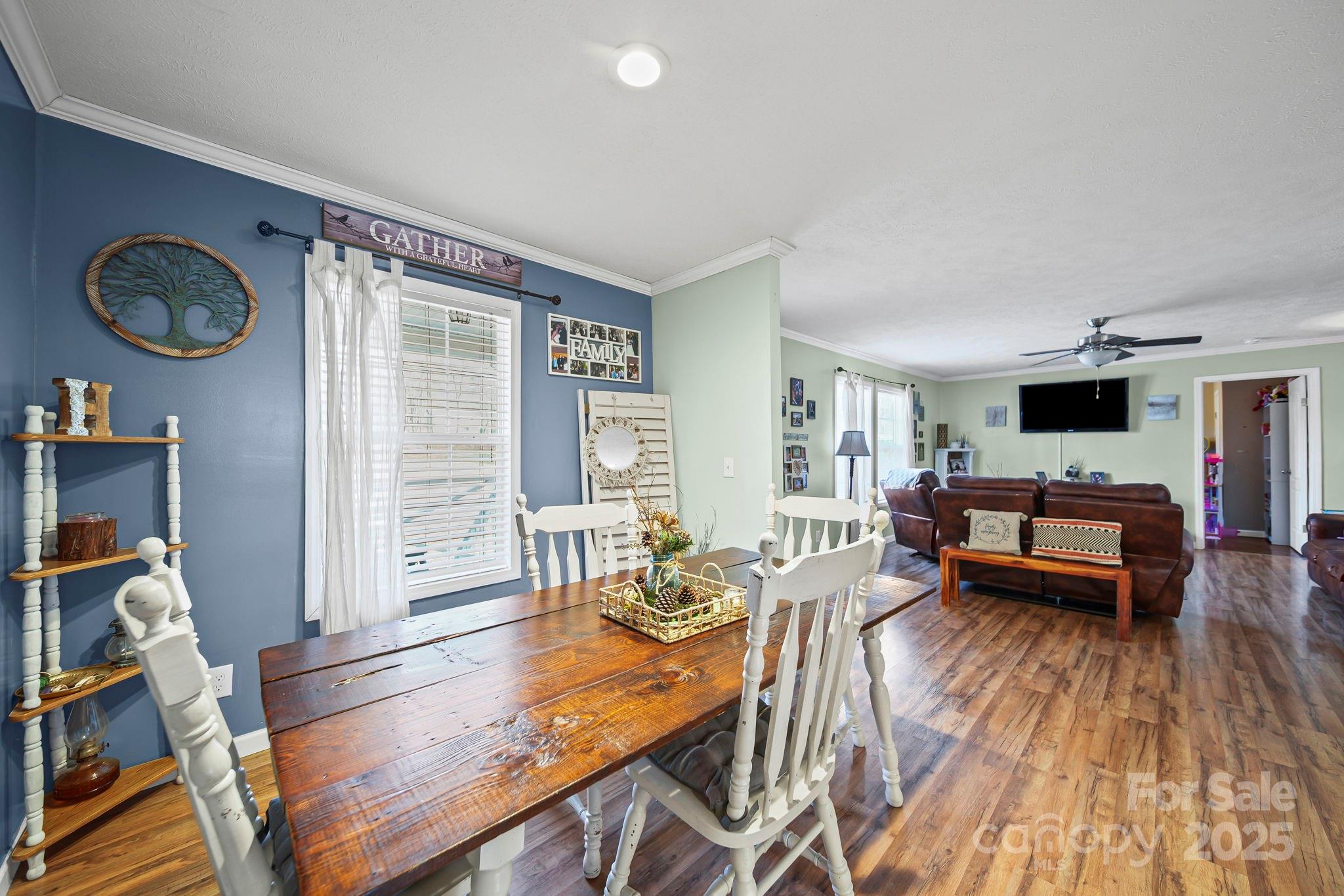 30291 C Red Hill Road Albemarle, NC 28001 - Photo 16 of 45 a living room with furniture a flat screen tv and a large window
