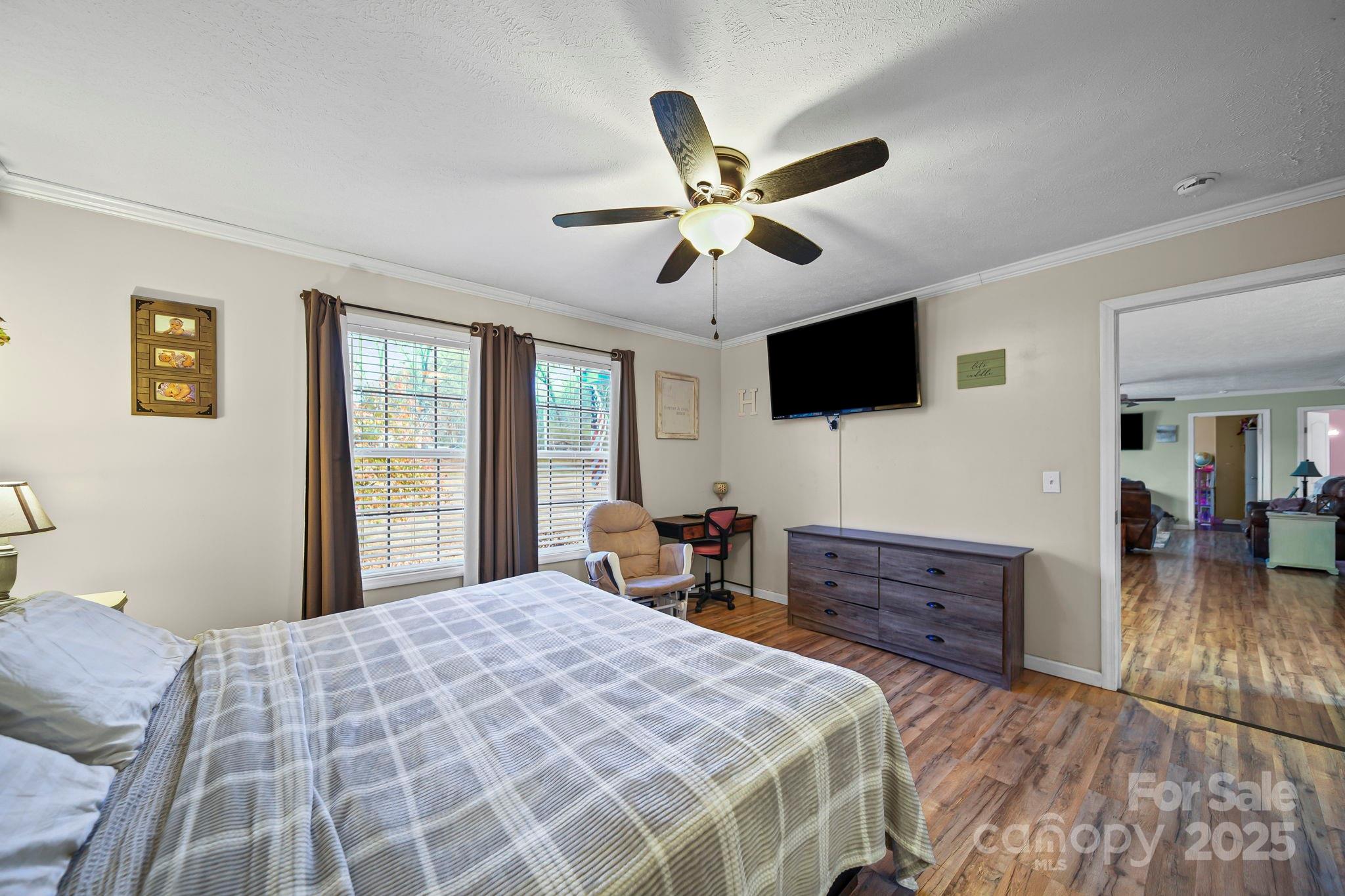 30291 C Red Hill Road Albemarle, NC 28001 - Photo 19 of 45 a bedroom with a bed and a flat screen tv