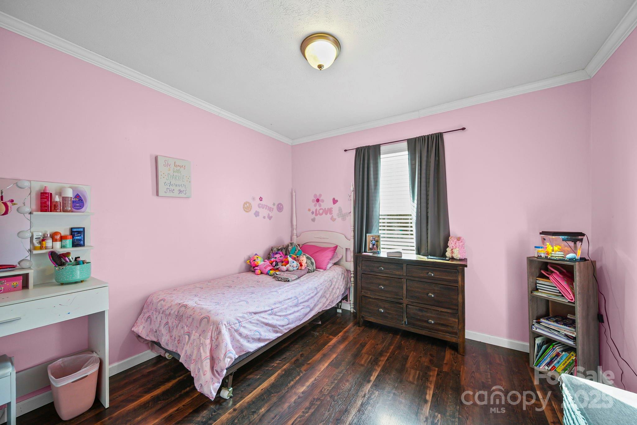 30291 C Red Hill Road Albemarle, NC 28001 - Photo 25 of 45 a bedroom with a bed and wooden floor