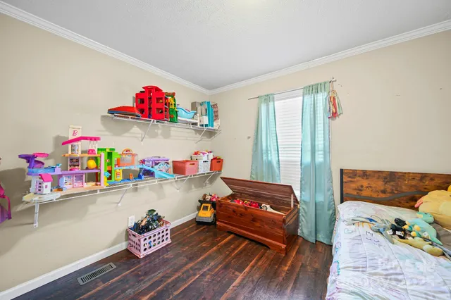 a room with toys and wooden floor