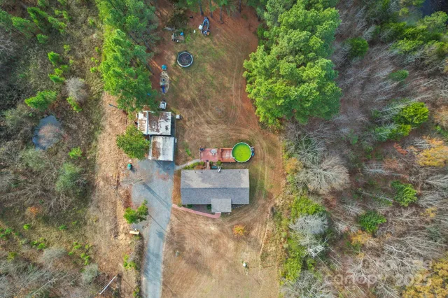 a aerial view of a house with a yard
