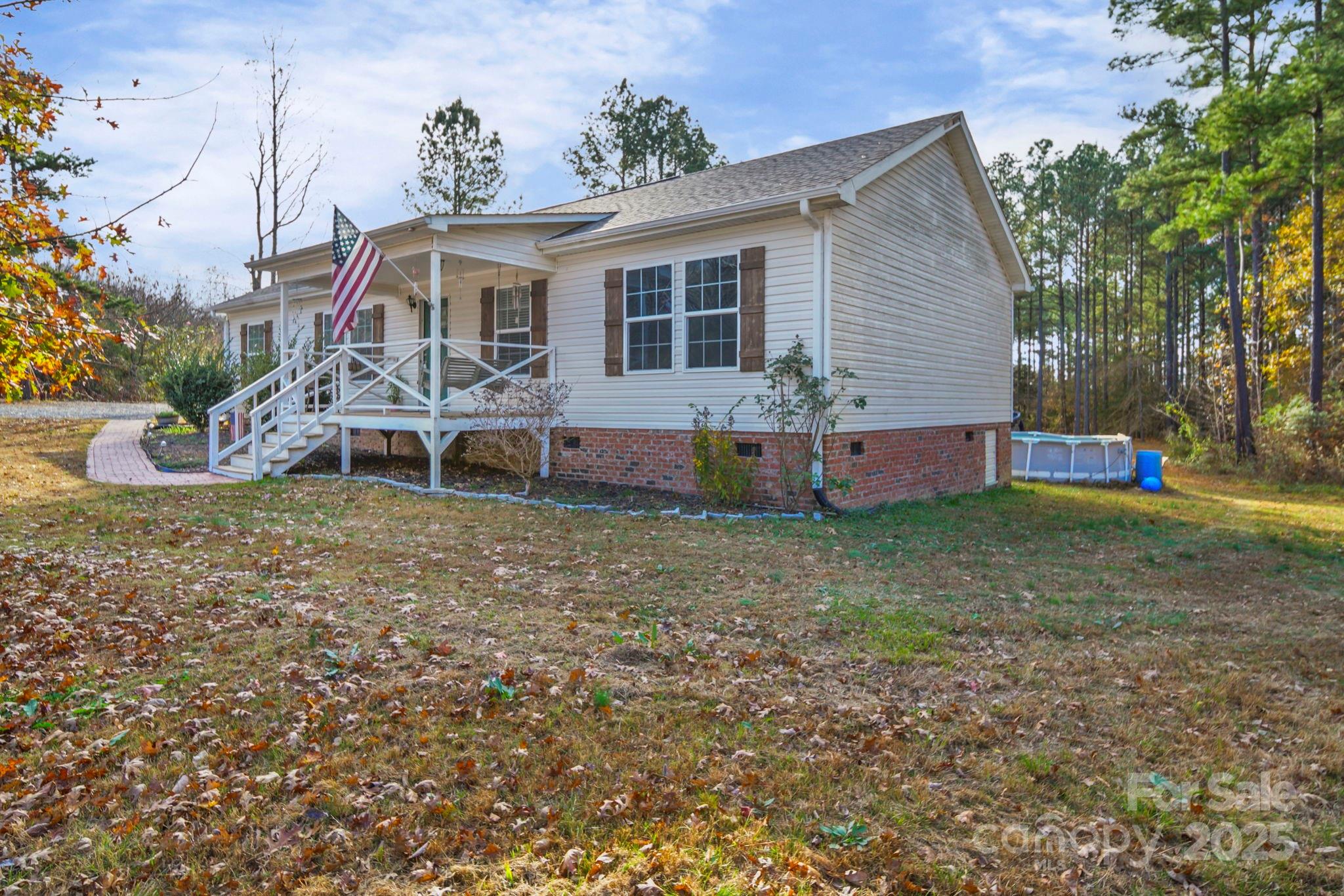 30291 C Red Hill Road Albemarle, NC 28001 - Photo 4 of 45 a front view of house with yard and seating area