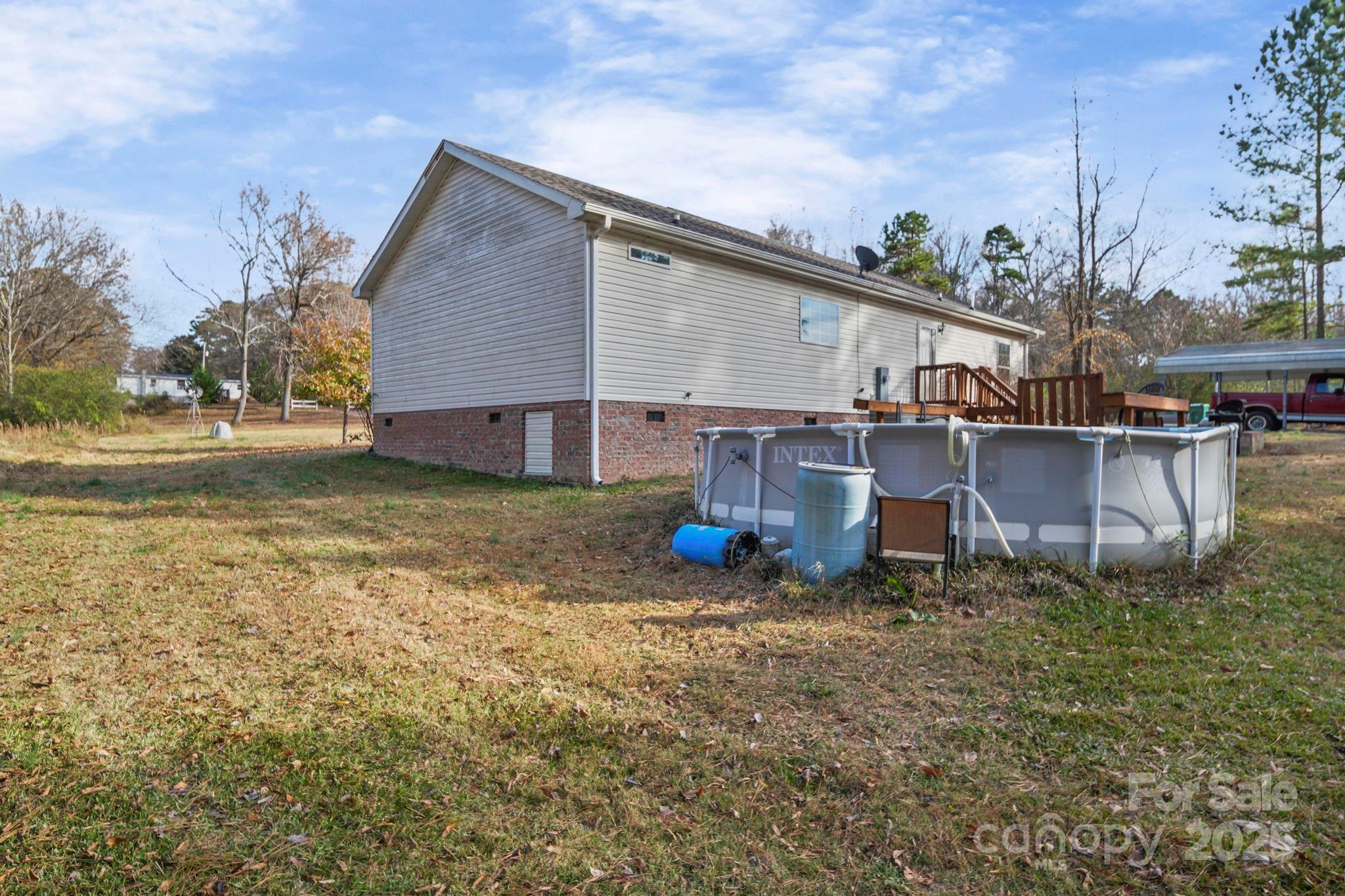 30291 C Red Hill Road Albemarle, NC 28001 - Photo 5 of 45 a view of a house with backyard porch and sitting area