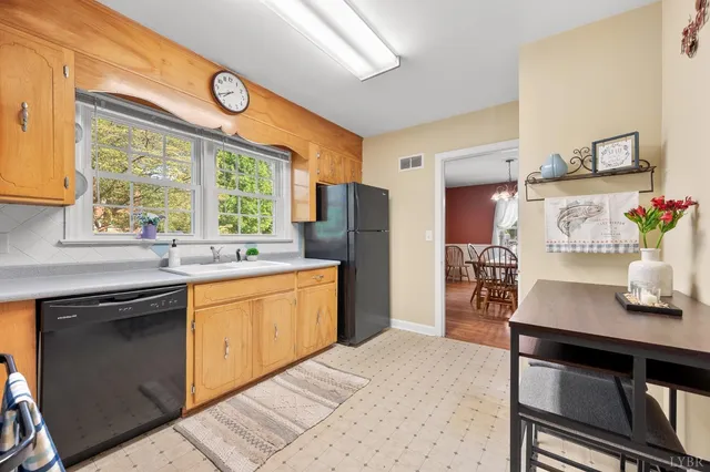 a kitchen with stainless steel appliances granite countertop a stove and a sink