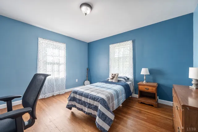 a bedroom with a bed and a chair