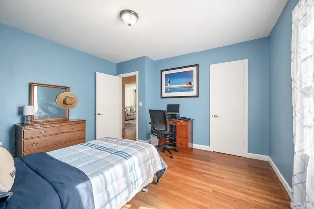 a bedroom with a bed and a dresser