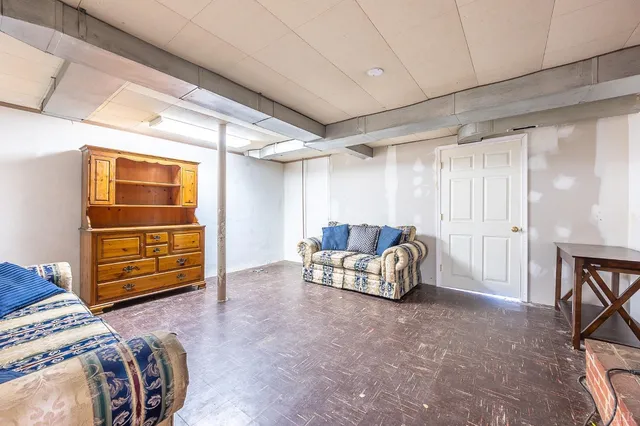 a bed room with a bed and a chair