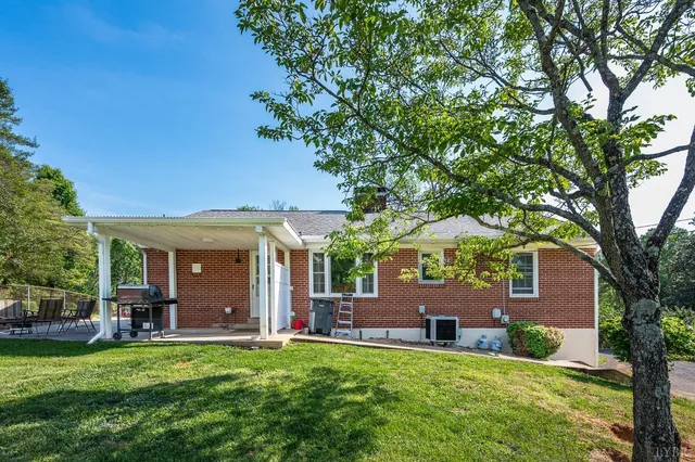 a view of a house with a yard porch and sitting area