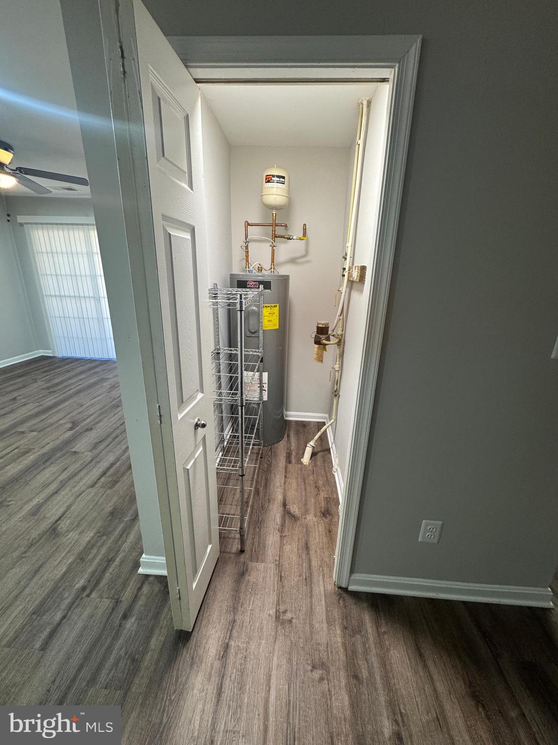 11263 Raging Brook Drive, Unit 253 Bowie, MD 20720 - Photo 9 of 22 a view of a hallway view with wooden floor and staircase