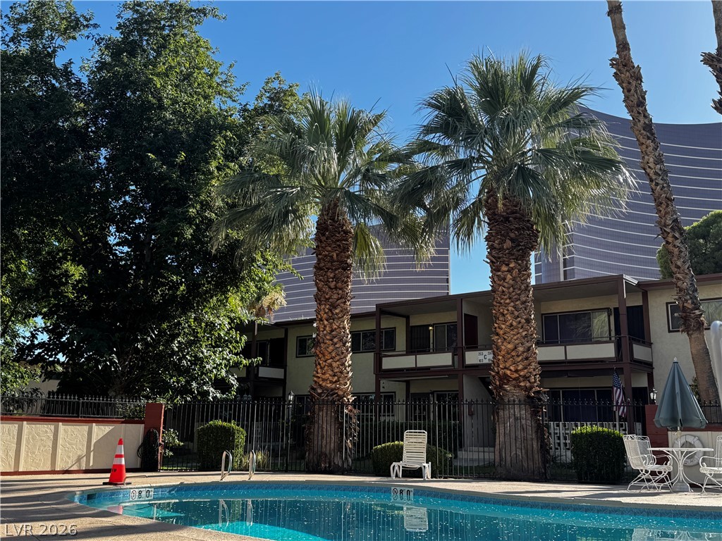 350 East Desert Inn Road, Unit C103 Las Vegas, NV 89109 - Photo 2 of 23 Pool Front unit.
Relax poolside in this tranquil setting, surrounded by lush palms and the captivating skyline.
