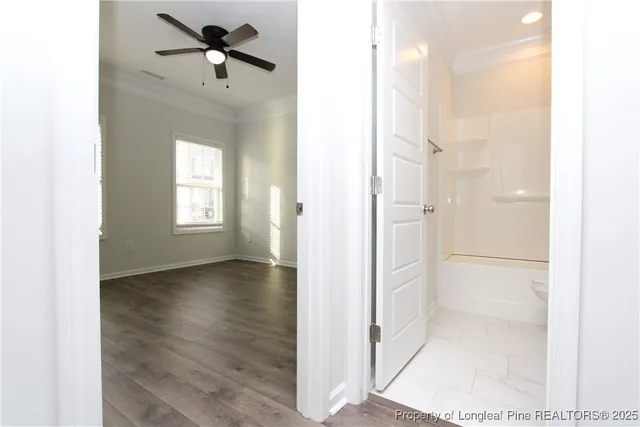 a bathroom with a sink toilet vanity and tub