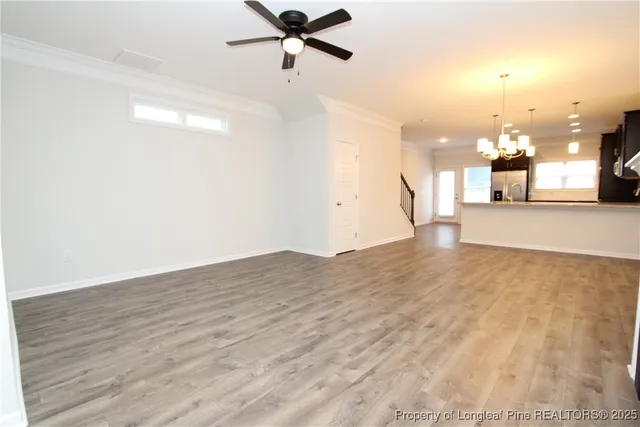 a view of a room with wooden floor