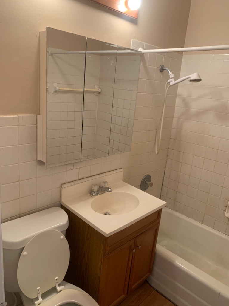 239 Northway Park Road, Unit 12 Machesney Park, IL 61115 - Photo 11 of 15 a bathroom with a sink toilet and shower