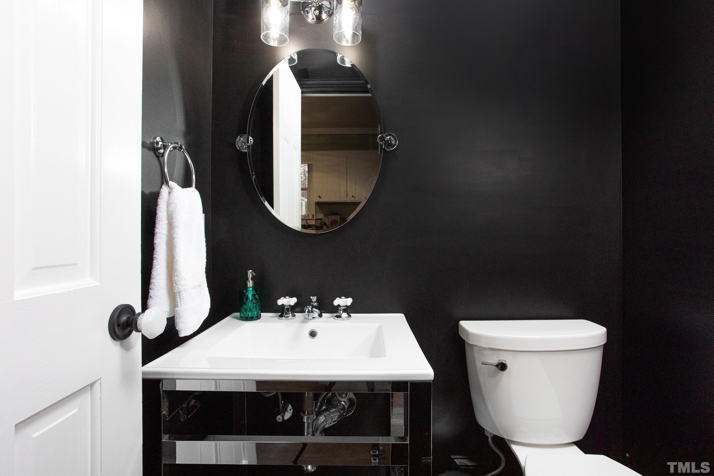 2501 Diamondhitch Trail Raleigh, NC 27615 - Photo 15 of 21 a bathroom with a toilet sink and mirror