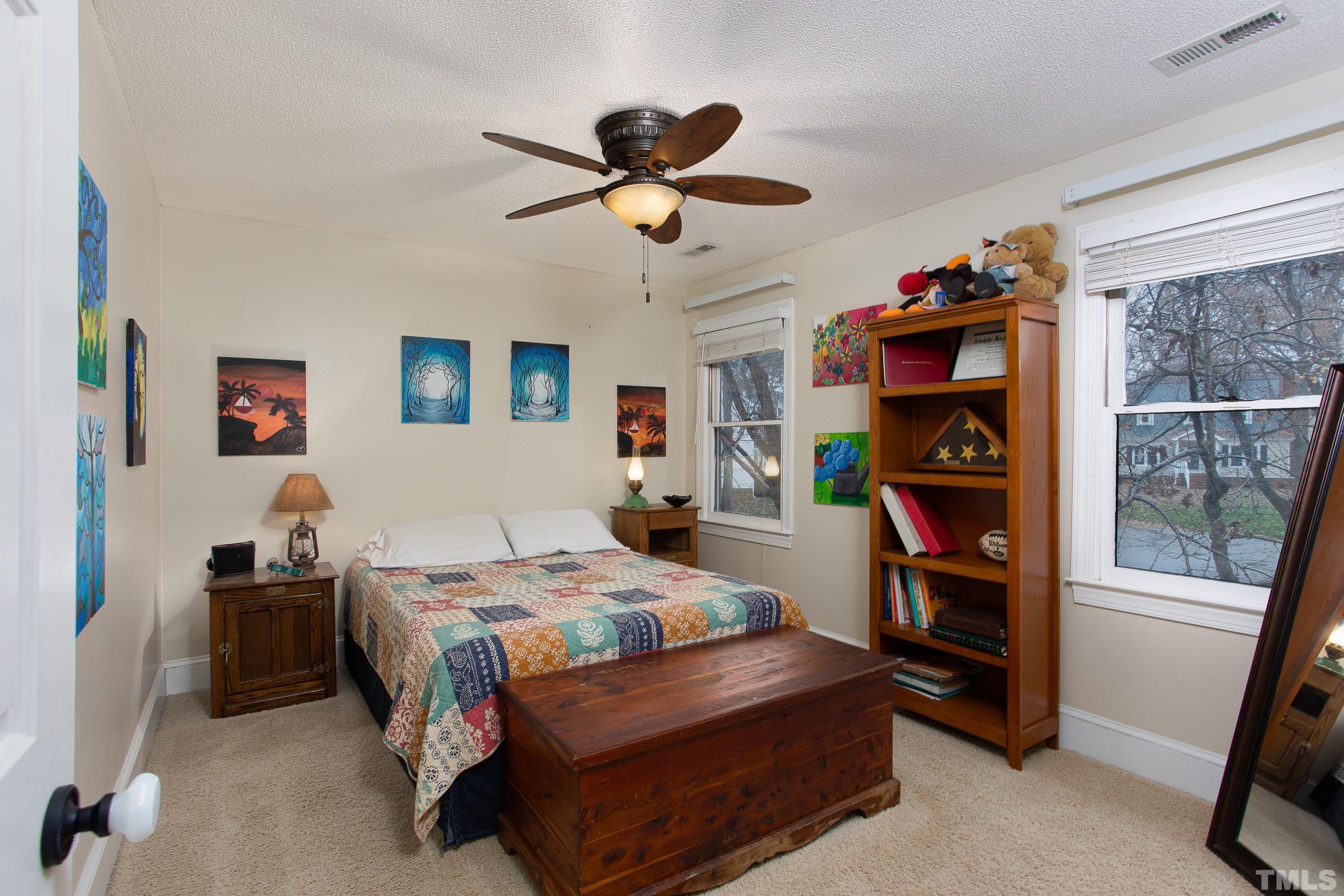 2501 Diamondhitch Trail Raleigh, NC 27615 - Photo 18 of 21 a bedroom with a bed closet and a window