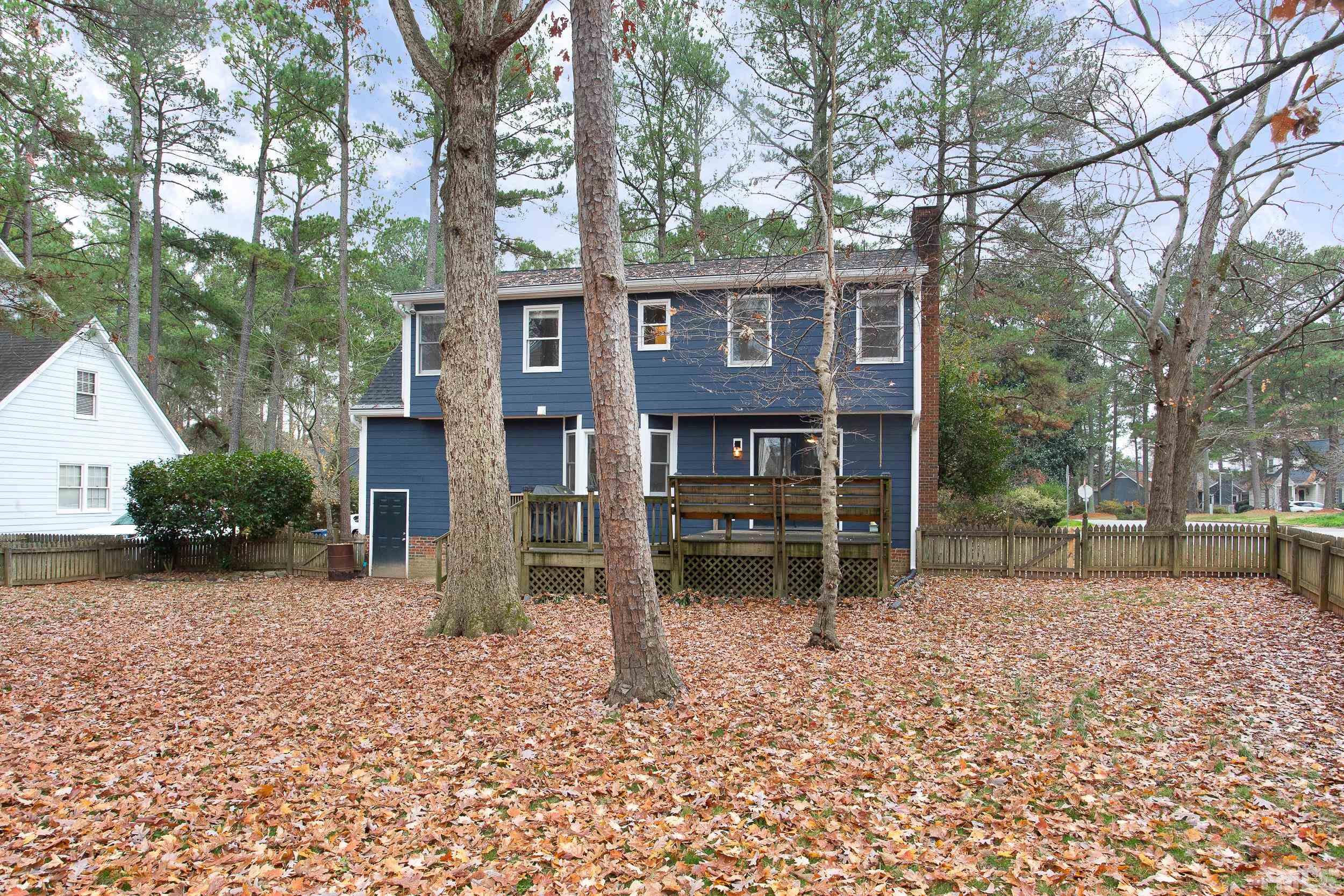 2501 Diamondhitch Trail Raleigh, NC 27615 - Photo 5 of 21 a backyard of a house with barbeque oven and table and chairs